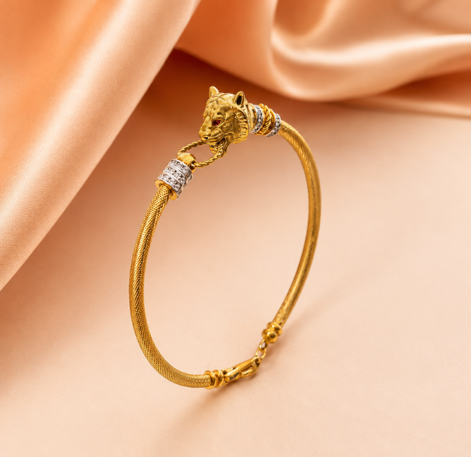 Gold bracelet with animal-head design detail