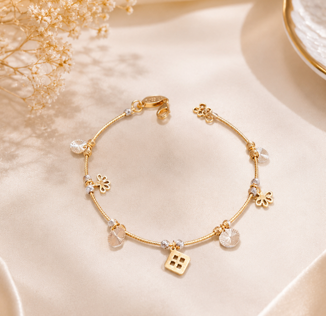 Floral and coin charm detail, gold