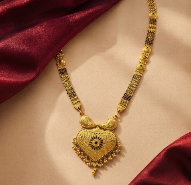 Heart-shaped gold pendant with bead droplets